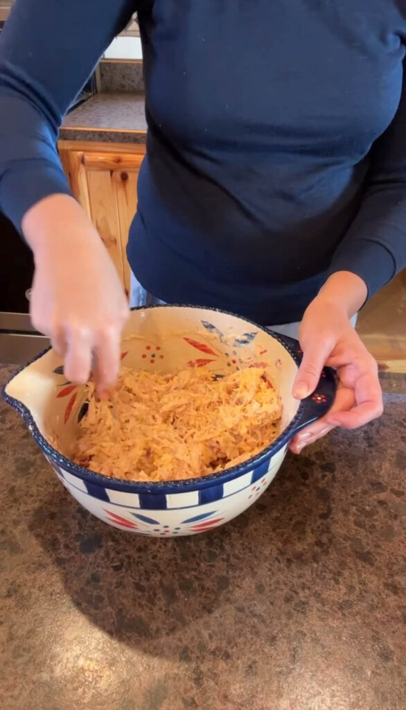 mixing up chicken filling