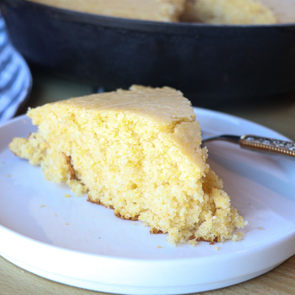 piece of sourdough cornbread on a plate square