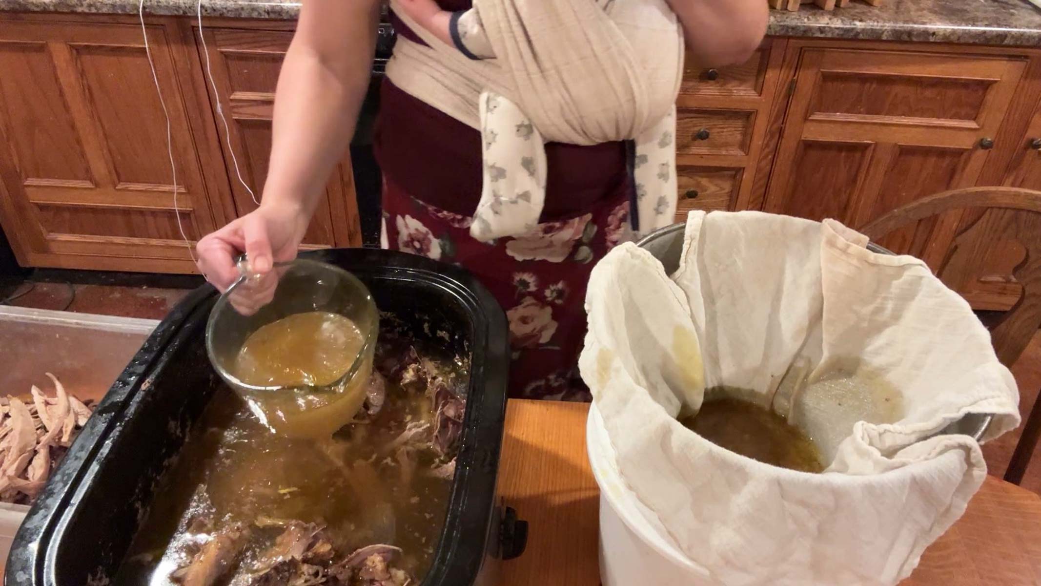 straining broth off of bones