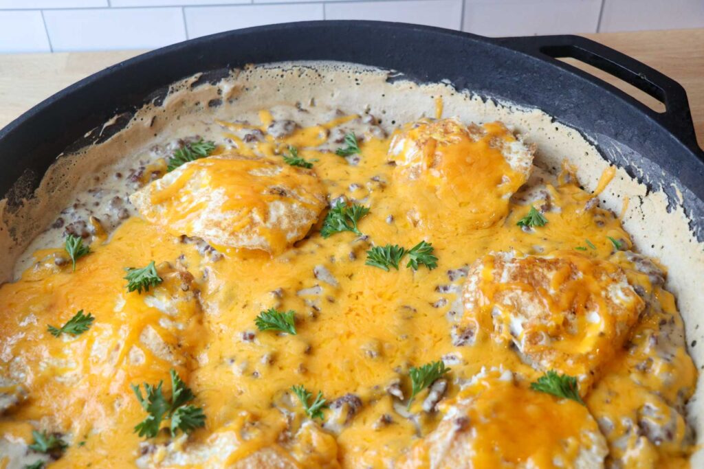 sourdough breakfast pizza with eggs and melted cheese close up