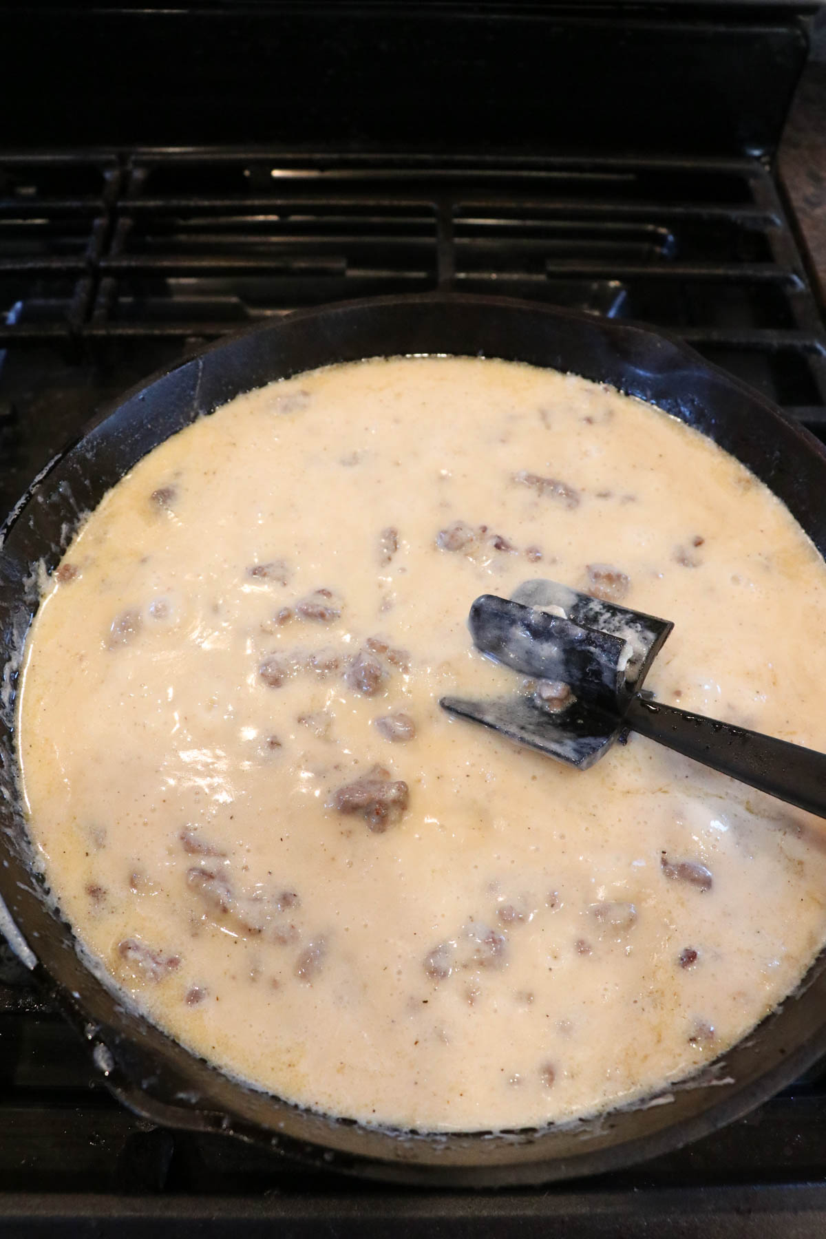 stirring gravy in the skillet until thick