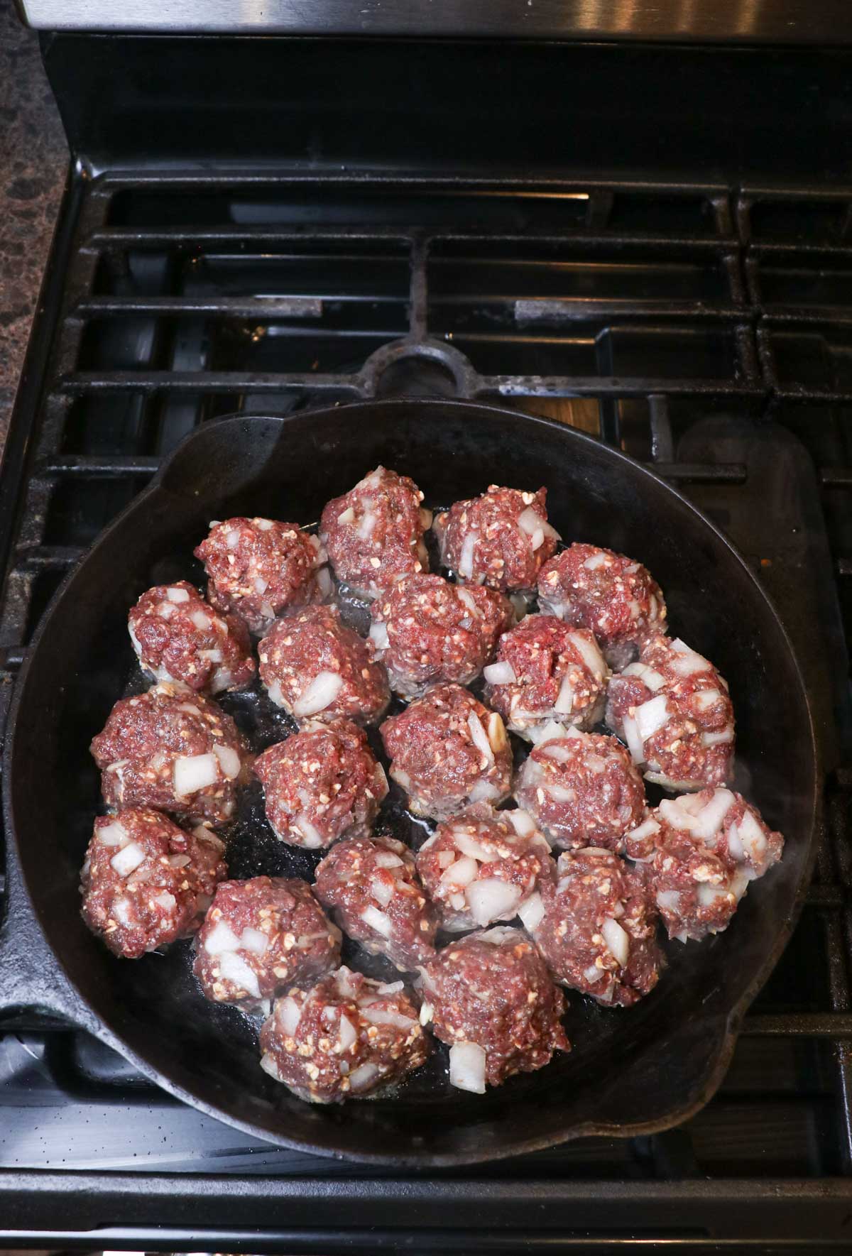 pan of meatballs for sauerkraut sausage soup